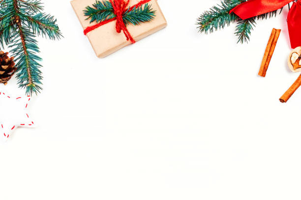 istock Christmas holidays  background with festive decorations and gift boxes on white  wooden board with copy space for your text 862778104