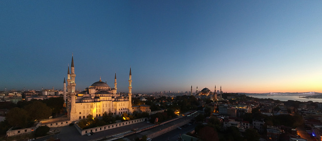 Panoramic and high angle image of Blue Mosque and Hagia Sophia while sunrise