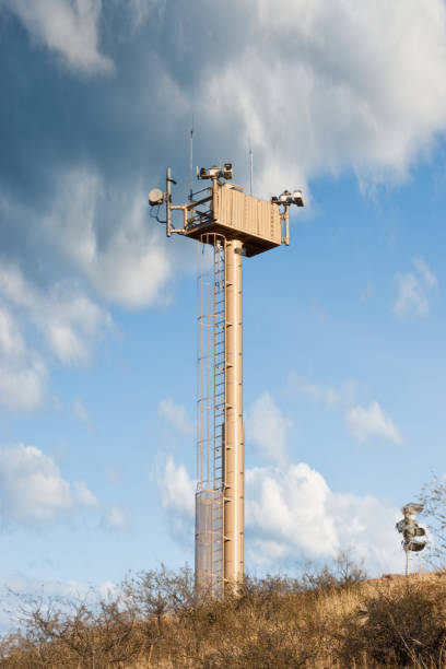 military radar tower against the blue sky, terrestrial building