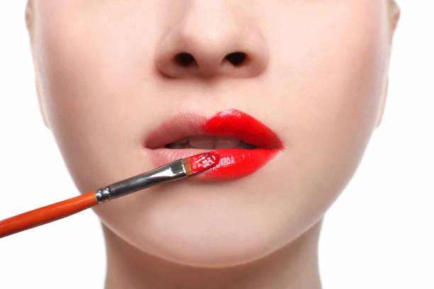 istock Make-up artist apply lipstick with brush, beauty 862785864