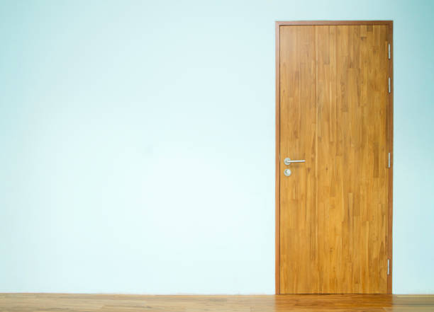 Wooden door with blue wall