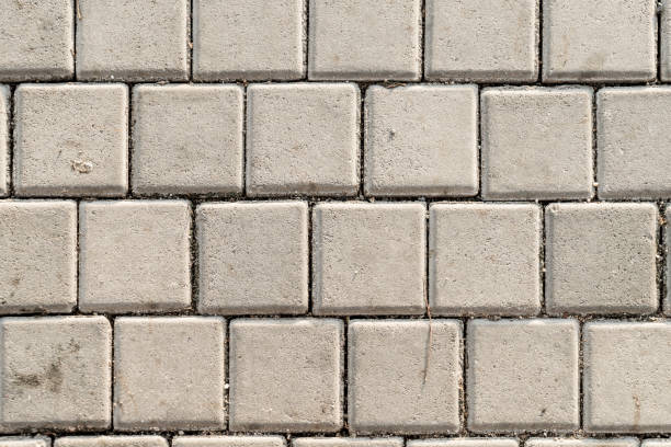 istock Dirty concrete footpath block floor texture background 862798114
