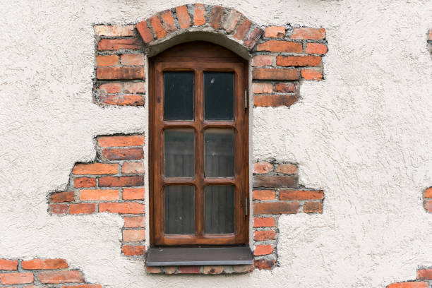 Old vintage window in brick wall
