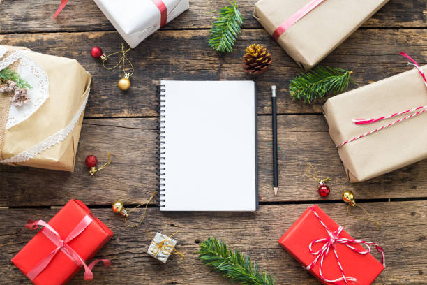 istock Christmas background,notebook and decorations with gift box on old wooden top view 862817854