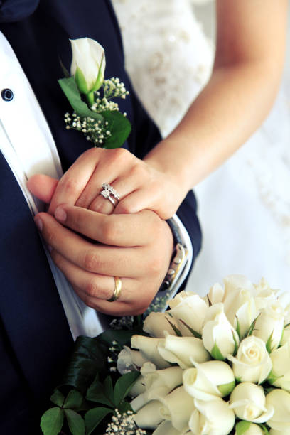 married couple holding hands - engagement wedding wedding ceremony ring imagens e fotografias de stock