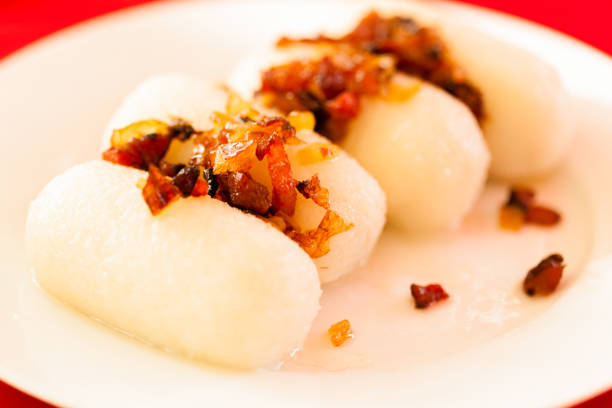 Kartacze - flour and potatoes croquetes with meat filling and lardons. Traditional food in Poland.Kartacze - flour and potatoes croquetes with meat filling and lardons. Traditional food in Poland.