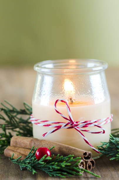 istock Candle in glass jar with Christmas decorations. 863096280