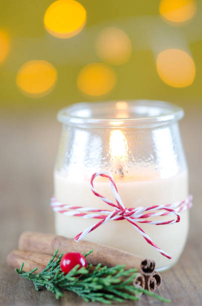 istock Candle in glass jar with Christmas decorations. 863096284
