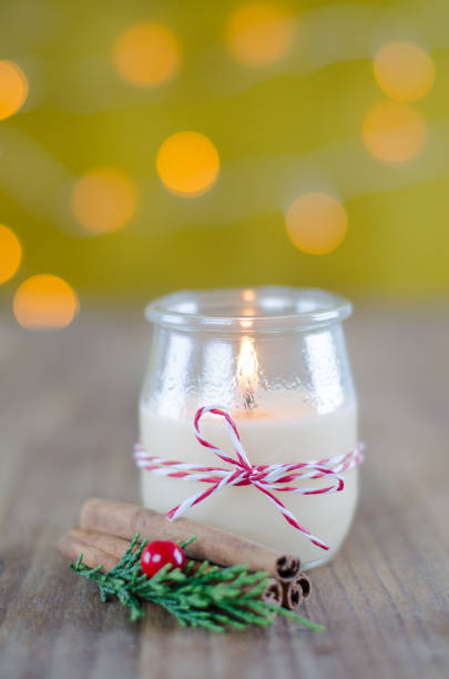 istock Candle in glass jar with Christmas decorations. 863096286