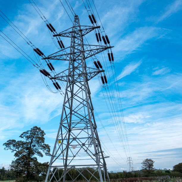 istock Electricity supply pylon against bright cloudy sky 863105710