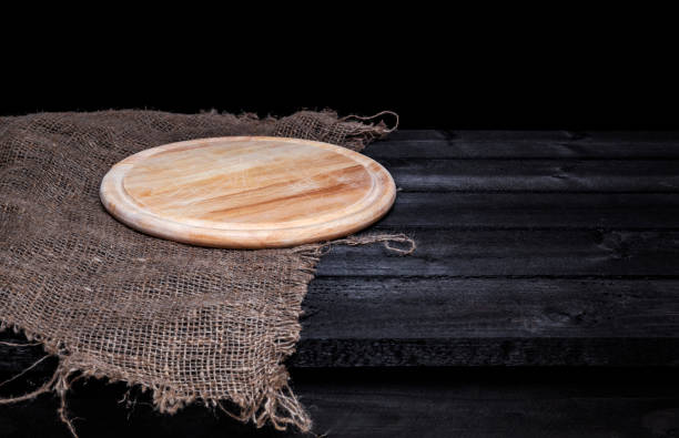 Dark wood table with tray for pizza. Montage product display