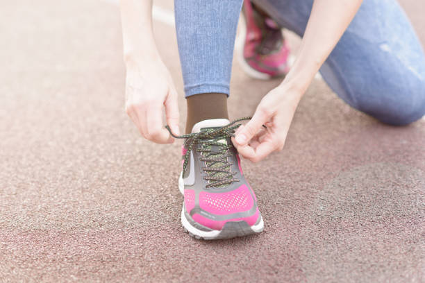 istock Tying sports shoe 863120288