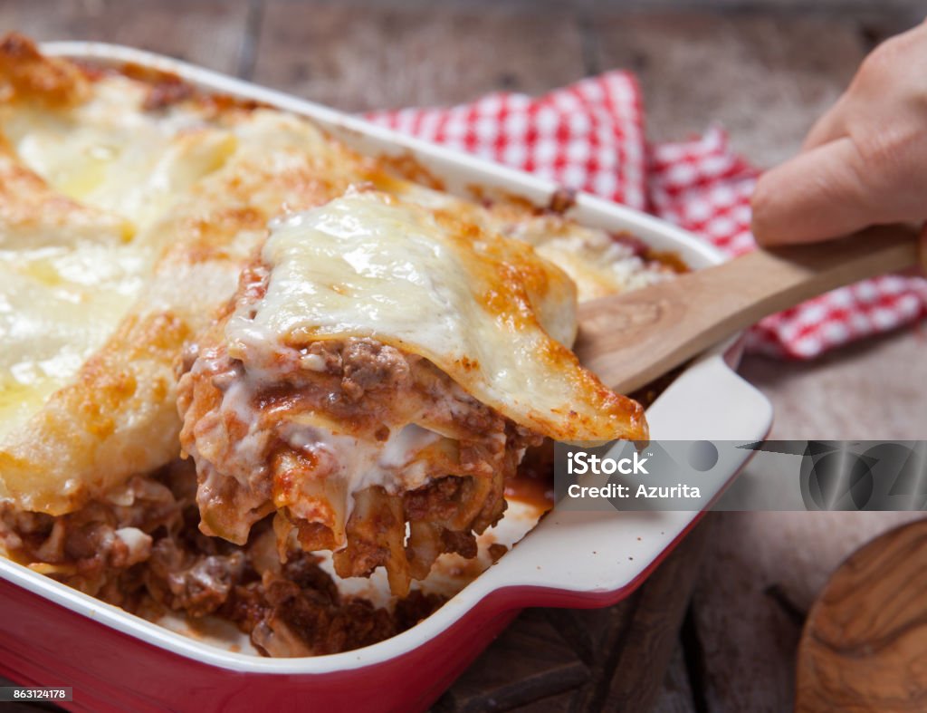 Tomato and ground beef lasagne rolls Tomato and ground beef lasagne rolls with cheese layered between sheets of traditional Italian pasta Baked Stock Photo