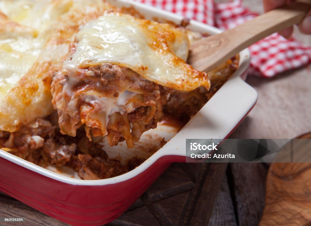 Tomato and ground beef lasagne rolls Tomato and ground beef lasagne rolls with cheese layered between sheets of traditional Italian pasta Baked Stock Photo