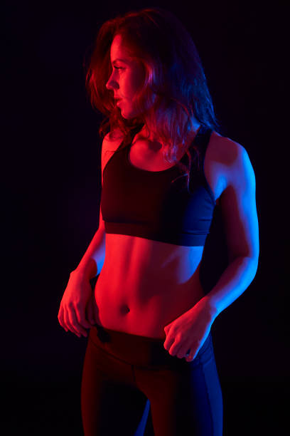 istock sporty woman, illuminated in color 863132728