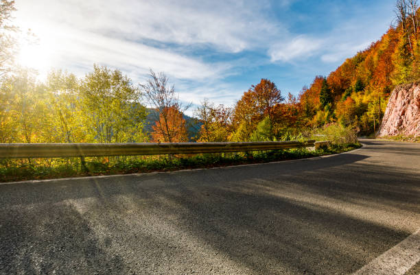 istock asphalt road through autumn forest in mountains 863133022