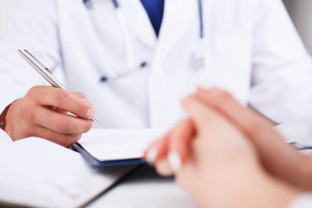 istock Male doctor arm hold silver pen 863133340