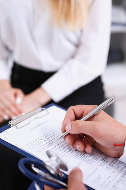 istock Male doctor arm hold silver pen 863133500
