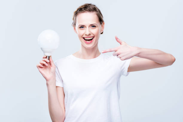 istock woman pointing at light bulb 863138858