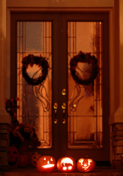 istock Jack-o-Lanterns sitting on the front door step for Halloween 863141422