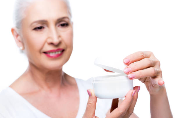 istock senior woman with anti-wrinkle cream 863142352