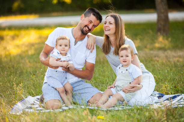 istock Family with Twins Outdoors 863142494