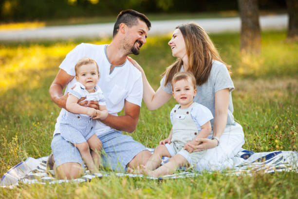 istock Family with Twins Outdoors 863142496
