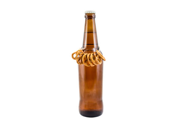 istock Bottle of beer with pretzels isolated on white. 863147612