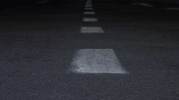 istock Street lane lines in closeup 863148652