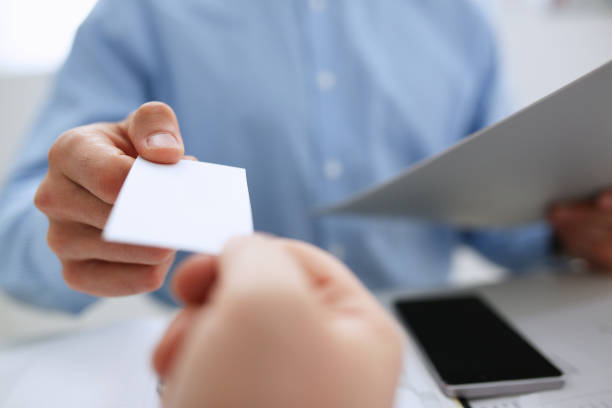 istock Male hand in suit give blank calling card 863152852