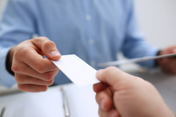 istock Male hand in suit give blank calling card 863152868