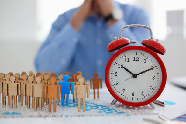 istock Man hand puts his blue silhouette on certain position organization 863155042