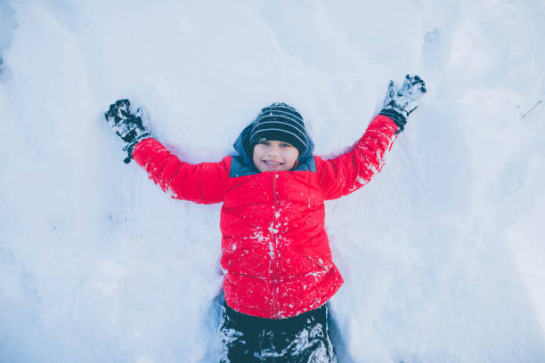 istock Little Boy Angel in Snow 863155990