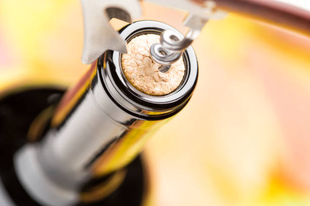 istock A closed bottle of red wine with corkscrew. Top view. 863158286