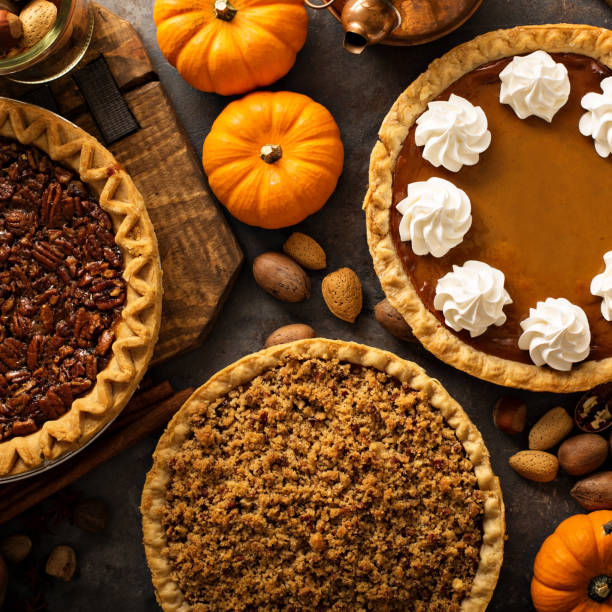 istock Fall traditional pies pumpkin, pecan and apple crumble 863158836