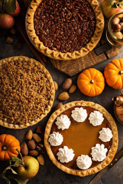 istock Fall traditional pies pumpkin, pecan and apple crumble 863159464