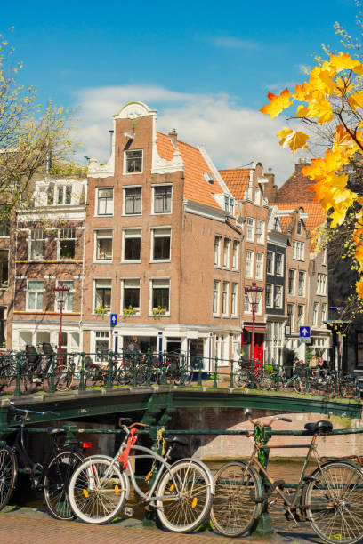 istock Old bicycle next to canal of Amsterdam 863159538