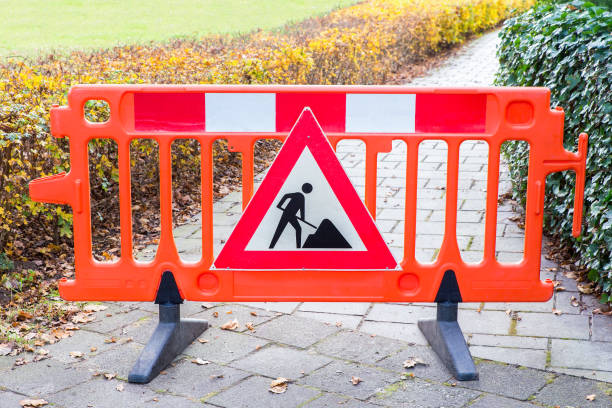 Red traffic warning sign for pedestrians Red traffic warning sign for pedestrians. In my hometown Delden in the netherlands the hikers path was blocked because they were working on it. The bright color clearly works as a reminder that you can't walk any further here. pavement ends sign stock pictures, royalty-free photos & images