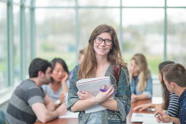 istock Multi-ethnic group of college students studying in conference room 863163982