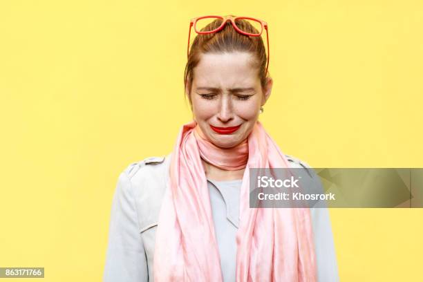 Portrait Of Unhappy And Depressed Young Caucasian Woman With Ginger Hair Feeling Ashamed Or Sick Human Face Expressions And Emotions Concept Stock Photo - Download Image Now