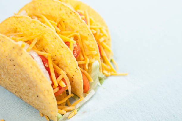 istock Mexican food crunchy beef tacos in a row. 863171898