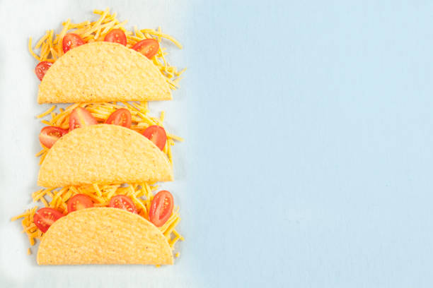istock Mexican food crunchy beef tacos in a row. 863176170