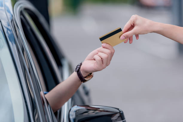 istock man paying with credit card 863182430