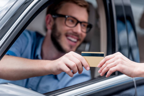 istock man paying with credit card 863186956