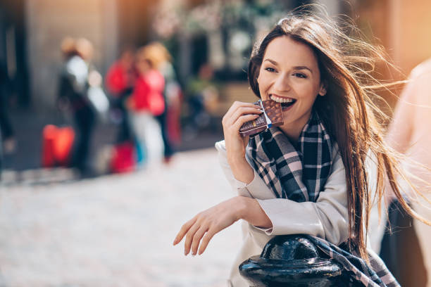 istock Happy woman eating chocolate 863190200
