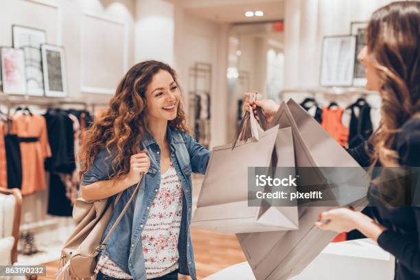 Happy Girl Shopping In The Fashion Store Stock Photo - Download Image Now - Shopping, Shopping Mall, Shopping Bag