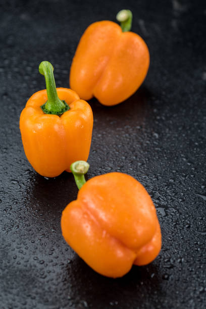 istock Paprika (orange) on a vintage looking slate slab (selective focus) 863199632