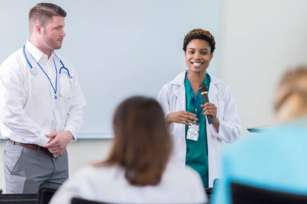 istock Confident African American physician addresses colleagues during conference 863232220