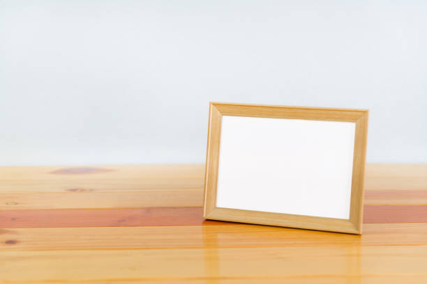 istock Empty wood photo frame on wooden table with copy space, picture memory. 863244676
