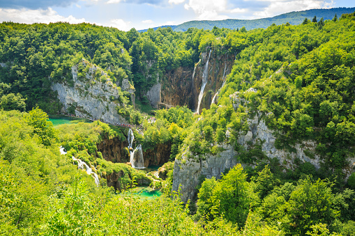 Colorful aerial scenic view on the forest, trees, landscape, blue water lakes and waterfalls of Plitvice lakes, Croatia